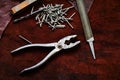 Pliers, nails, a file, an old rusty piece of metal Royalty Free Stock Photo
