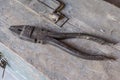 pliers over old tools for housework Royalty Free Stock Photo