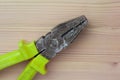 Pliers with rubber handles. Multitool pliers close up. Construction or repair tool Royalty Free Stock Photo