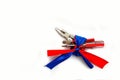 Pliers screwdriver metal pliers screwdriver cutter flag red blue white ribbon bow postcard background labor Dutch Royalty Free Stock Photo