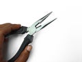 Pliers  on white background. Hand holding a cutter pliers Copy space Royalty Free Stock Photo