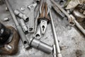 Pliers and wrenches on the table in the garage. Royalty Free Stock Photo