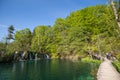 Plitvice Lakes National Park, Croatia. Tourists walk on the wood bridge