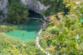 Plitvice Lakes National Park in Croatia. View from Above. Tourists Enjoy the Tour on the Wooden Pathway. Royalty Free Stock Photo