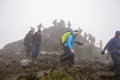 PLLandudno, Wales, UK - MAY 27, 2018 people climbing down from the mountain. Mountaineers descending from the mountain. Group back