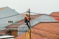 PLN workers repairing the electricity