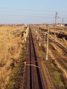 Plot railway. Top view on the rails. High-voltage lines for electric trains Royalty Free Stock Photo