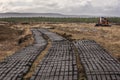 Plots of turf on Irish bog. It was cut with a digger and a hopper.