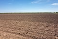 Ploughed field and blue sky Royalty Free Stock Photo