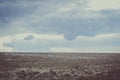 Ploughed field and blue sky landscape Royalty Free Stock Photo