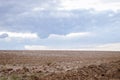 Ploughed field and blue sky landscape Royalty Free Stock Photo