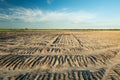 Ploughed field and cloud on blue sky Royalty Free Stock Photo