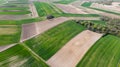 Ploughed or Plowed and Cultivated Fields in Farm. Geometric Fields Shapes. Aerial Drone View