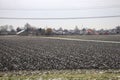 ploughed potato field with a little of snow in Zevenhuizen Royalty Free Stock Photo