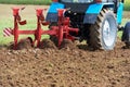 Ploughing tractor at field cultivation work