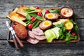 Ploughman`s lunch on a wooden board, close-up