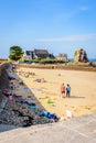 People enjoying the beach of Pors Hir in Brittany, France