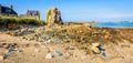 Granite houses and boulder in the harbor of Pors Hir in Brittany, France