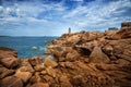 Ploumanach Mean Ruz lighthouse between the rocks in pink granite coast, Perros Guirec, Brittany, France Royalty Free Stock Photo