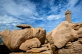 Ploumanac`h Mean Ruz lighthouse between the rocks in pink granite coast, Perros Guirec, Brittany, France. Royalty Free Stock Photo