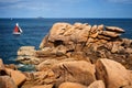 Ploumanac`h Mean Ruz lighthouse between the rocks in pink granite coast, Perros Guirec, Brittany, France. Royalty Free Stock Photo