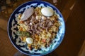 Plov pilaf plate on black background. Traditional Uzbek cuisine. Top angle. Selective focus