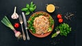 Plov Rice with meat and vegetables on a plate. Uzbek cuisine. On a wooden background. Top view