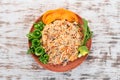 Plov Rice with meat and vegetables on a plate. Uzbek cuisine. On a wooden background. Top view