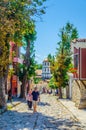 PLOVDIV, BULGARIA, AUGUST 2, 2014: A couple is promenading through old town street in the Bulgarian city Plovdiv Royalty Free Stock Photo