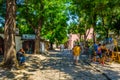 PLOVDIV, BULGARIA, AUGUST 2, 2014: Toursits are promenading through old town street in the Bulgarian city Plovdiv Royalty Free Stock Photo