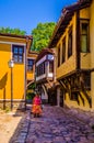 PLOVDIV, BULGARIA, AUGUST 2, 2014: A woman is promenading through old town street in the Bulgarian city Plovdiv....IMAGE Royalty Free Stock Photo