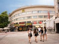 Girls in short pants and shops and bet in the background in Plovdiv Bulgaria