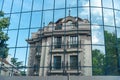 Reflection of the building in the mirrored wall