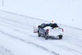 Plow trucks on highway after snow storm 2013