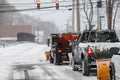 Plow trucks on street after storm 2015