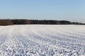 plowed agricultural field covered by snow Royalty Free Stock Photo