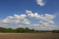 Plowed agricultural field under beautiful spring sky Royalty Free Stock Photo