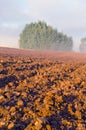 Plowed farm field and morning mist Royalty Free Stock Photo