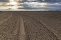 Plowed farm field at the sunset Royalty Free Stock Photo