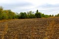 Plowed field in autumn fall. Harvest time. Plowed land Royalty Free Stock Photo