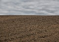 Plowed field and dramatic sky Royalty Free Stock Photo