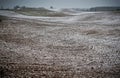 Plowed field and little snow