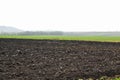 Plowed field in wintertime Royalty Free Stock Photo