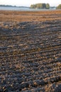 Plowed frosty autumn farmland field and mist Royalty Free Stock Photo