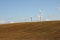Plowed land and wind turbine in the Champagne Royalty Free Stock Photo