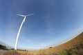 Plowed land and windmill in France Royalty Free Stock Photo