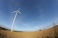 Plowed land and windmill in France Royalty Free Stock Photo