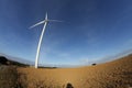 Plowed land and windmill in France Royalty Free Stock Photo