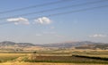 Plowed wheat fields, hills and sky. view. Royalty Free Stock Photo