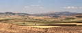 Plowed wheat fields, hills and sky. view. Royalty Free Stock Photo